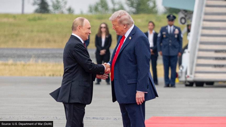 President Trump shakes hands with Russian President Putin.